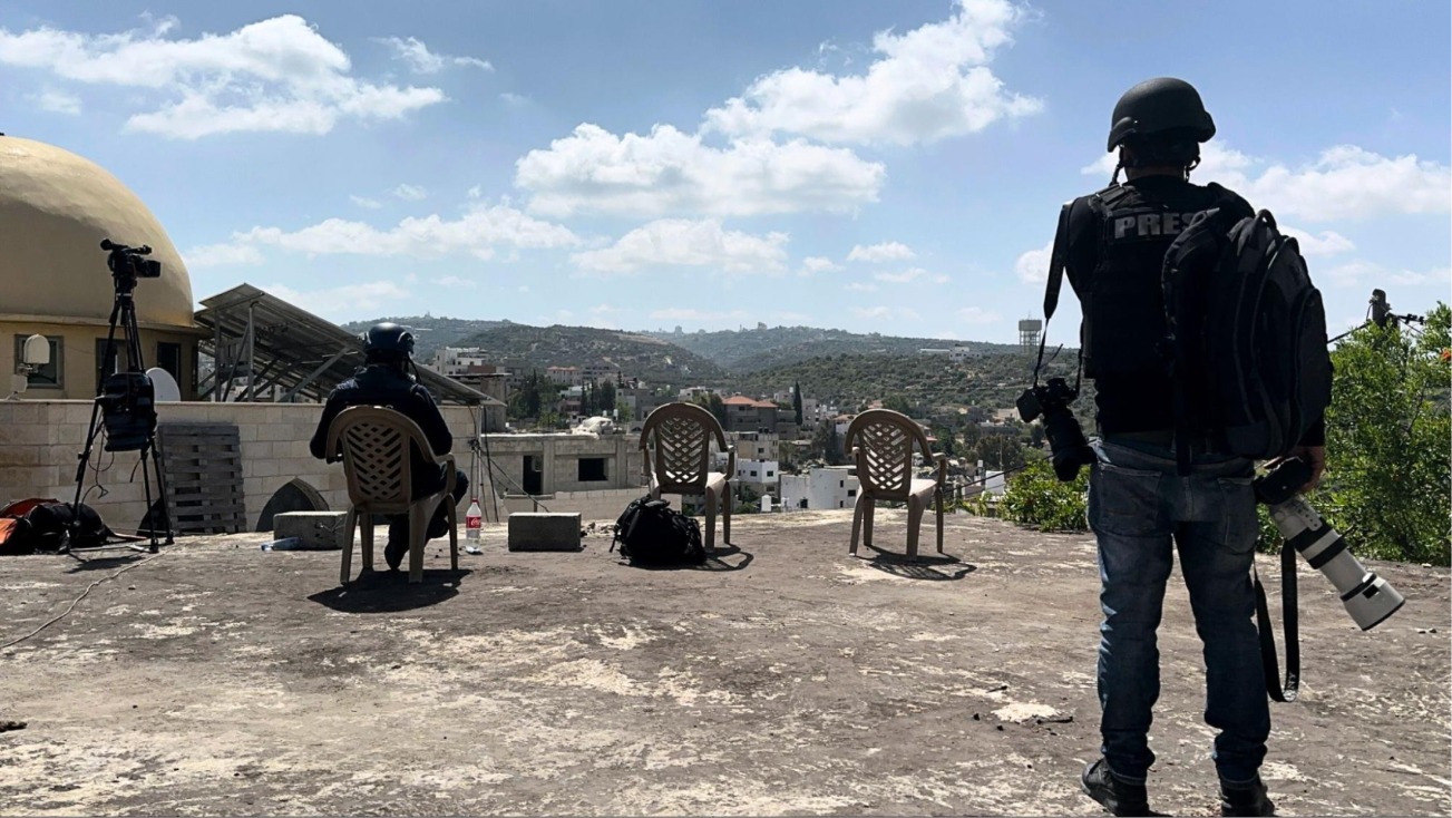 Journalists reporting from a rooftop in Deir Al-Ghusun, the morning of May 4, 2024 (Source: Issam Rimawi/ freelancer).